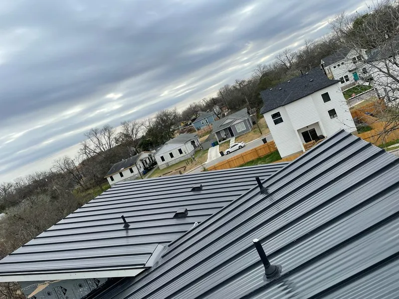 Standing seam metal roof panels with vents for Skylight Repair in Edina